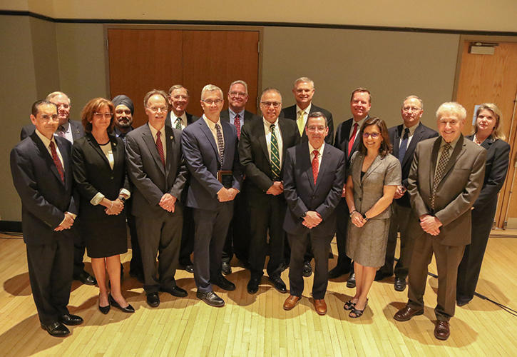 The Civil Engineering Institute members work with the Sid and Reva Dewberry Department of Civil, Environmental, and Infrastructure Engineering. Front row, left to right: Helman Castro, Cerasela Cristei, Kurt Thompson, James Patteson, Sam Salem, Michael Post, Terry Suehr, and Howell Simmons. Back row, left to right: Rich Benton, Hardeep Rana, Chris Reseigh, Doug Kennedy, Joe Manous, Brian Chromey, William Haight III, and Jaime Bain Hedges.